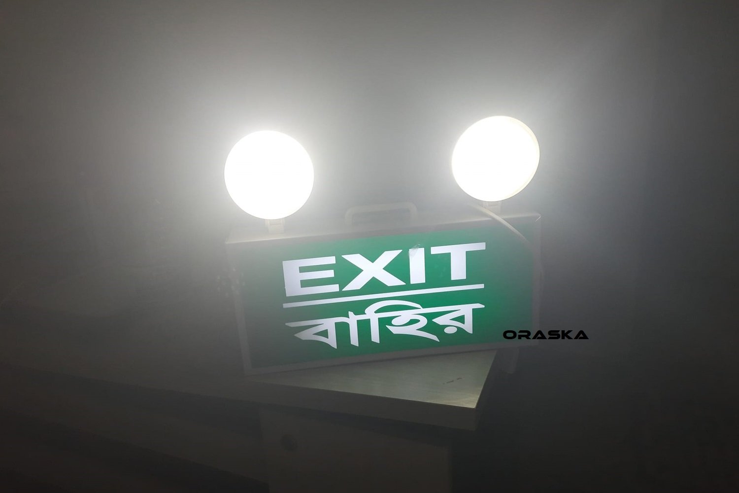 ORASKA EXIT-FOG COMBO Light CB7157 – 17×15×2.5 inch, 10W LED Fog + 3W Green EXIT Sign, 6V-4.5AH Battery, 2 Hr Backup, 5000K Cool Daylight, 60-70 LUX, UL FM NFPA RSC Accord Standard Bangladesh
